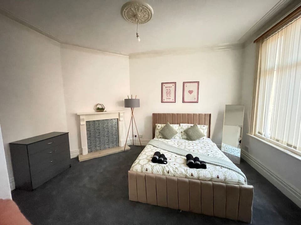 A bright, airy room designed for families, featuring ample space and modern décor for a relaxing stay.