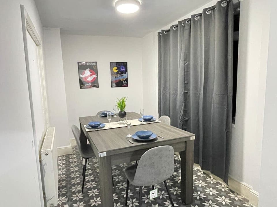 This contemporary dining area combines functionality and style, offering ample space for meals and a cosy ambiance for memorable dining experiences.