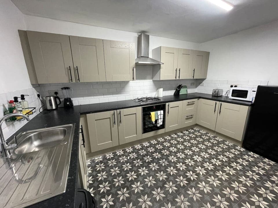 A charming kitchen with a classic design, equipped with rustic elements and plenty of counter space for culinary creations.