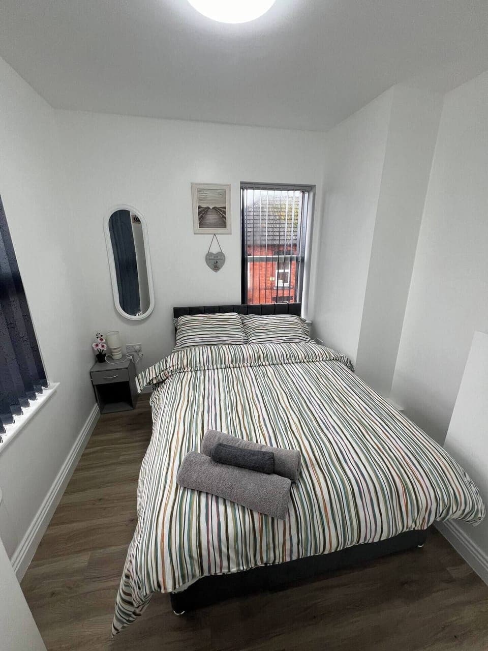 Bedroom 1:
Features:
1 x Double Bed with Storage 
