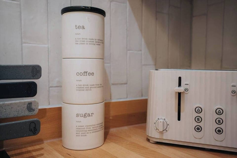 A shared kitchen with the essentials you need for a comfortable stay. Please note, the fridge is located privately in the room, not in the kitchen.
