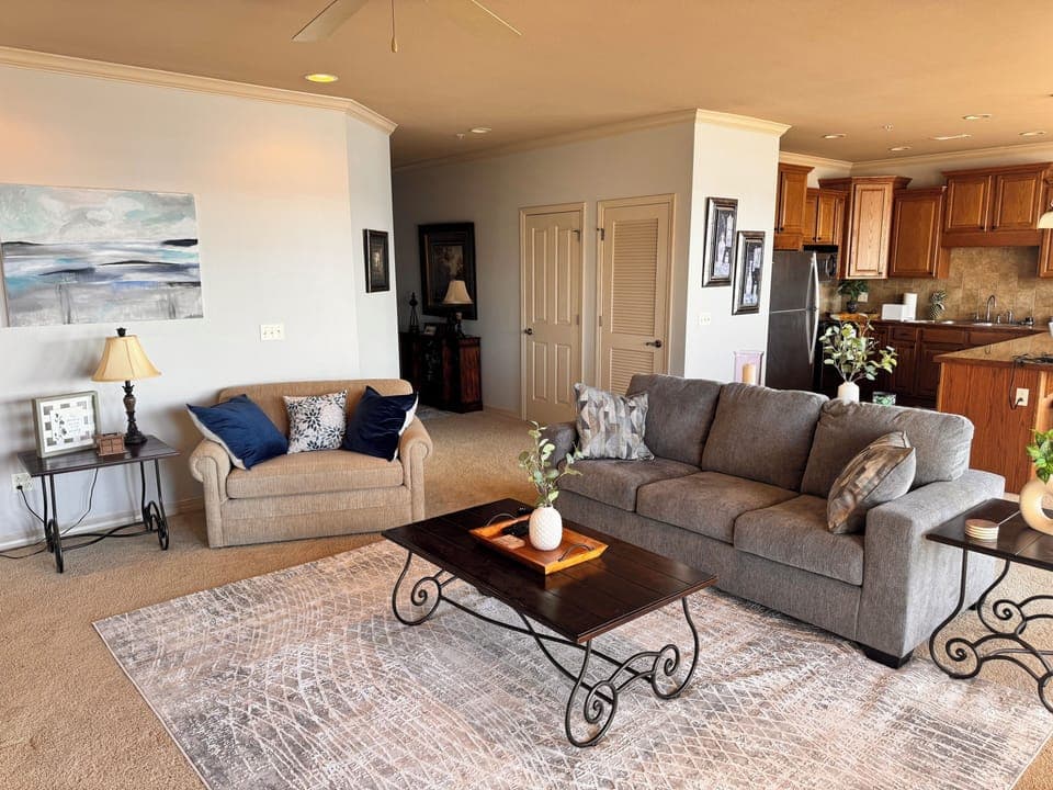 Living room looking back toward kitchen and entry hallway