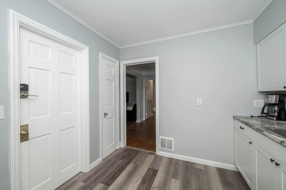 Apartment 1’s sleek kitchen offers ample space & all the comforts of home