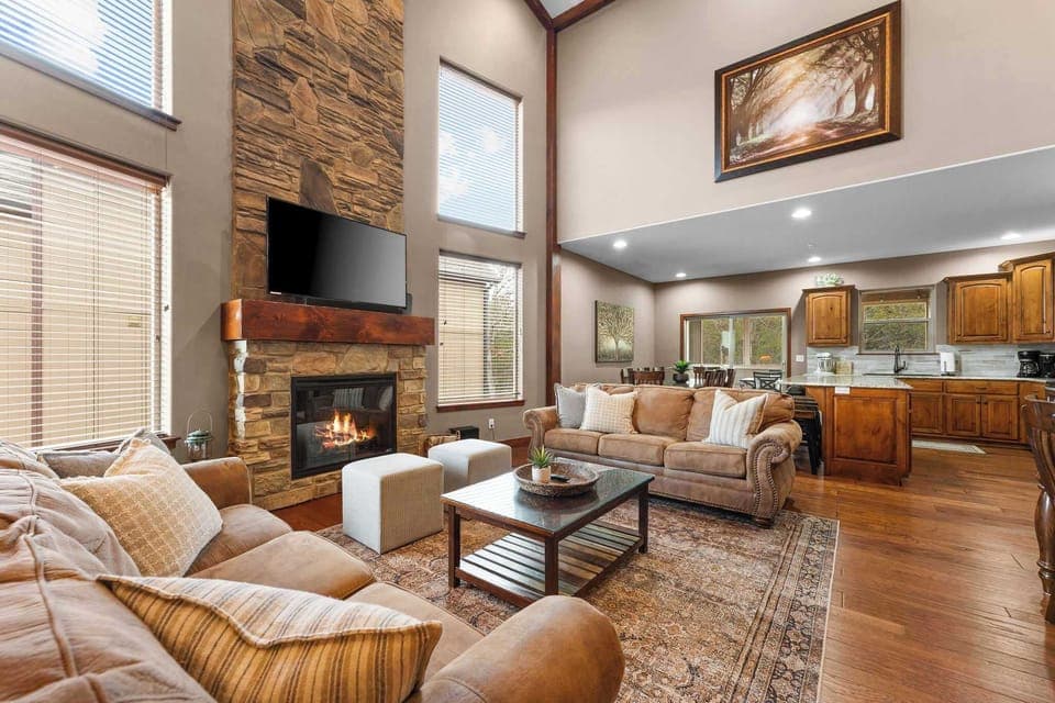 Vaulted ceilings and a stone fireplace create a grand living space!