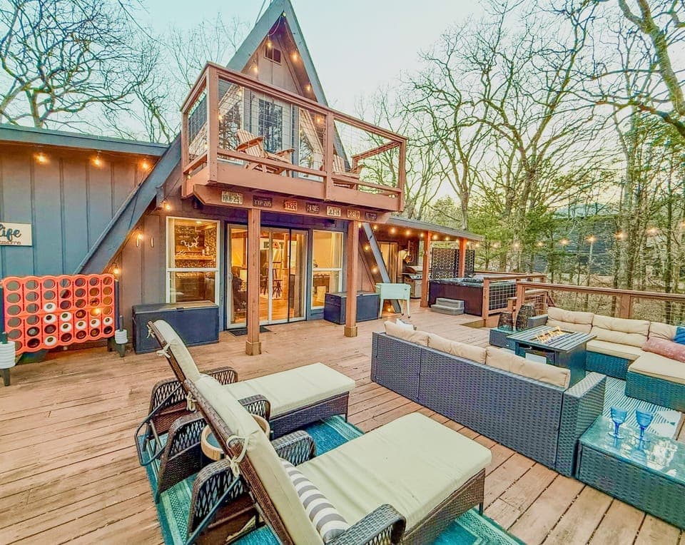 800 sf Deck | Fire table | Outdoor Cooler | Gas Grill (Propane Provided) | Private Hot Tub | Tons of Outdoor Games | Private Wooded Views | String Lights