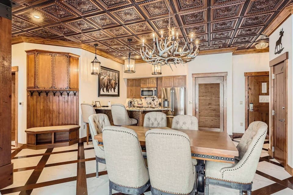 Formal dining area beside cozy fireplace.