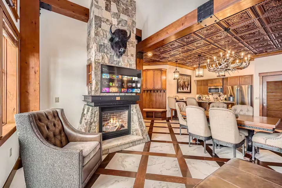 Lounge chairs near large windows and rustic decor