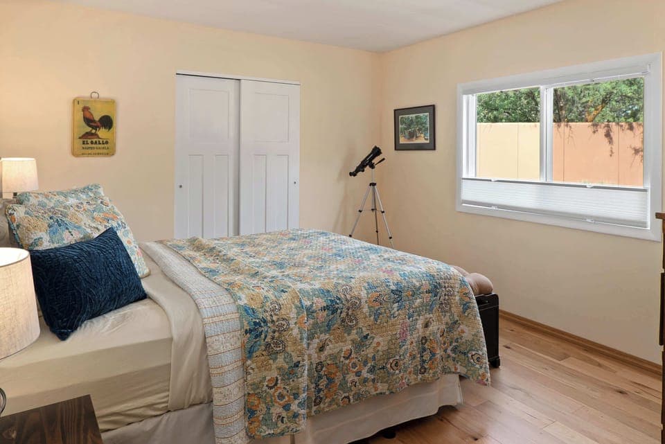 Spacious bedroom featuring stylish Southwestern decor and a queen-sized bed.