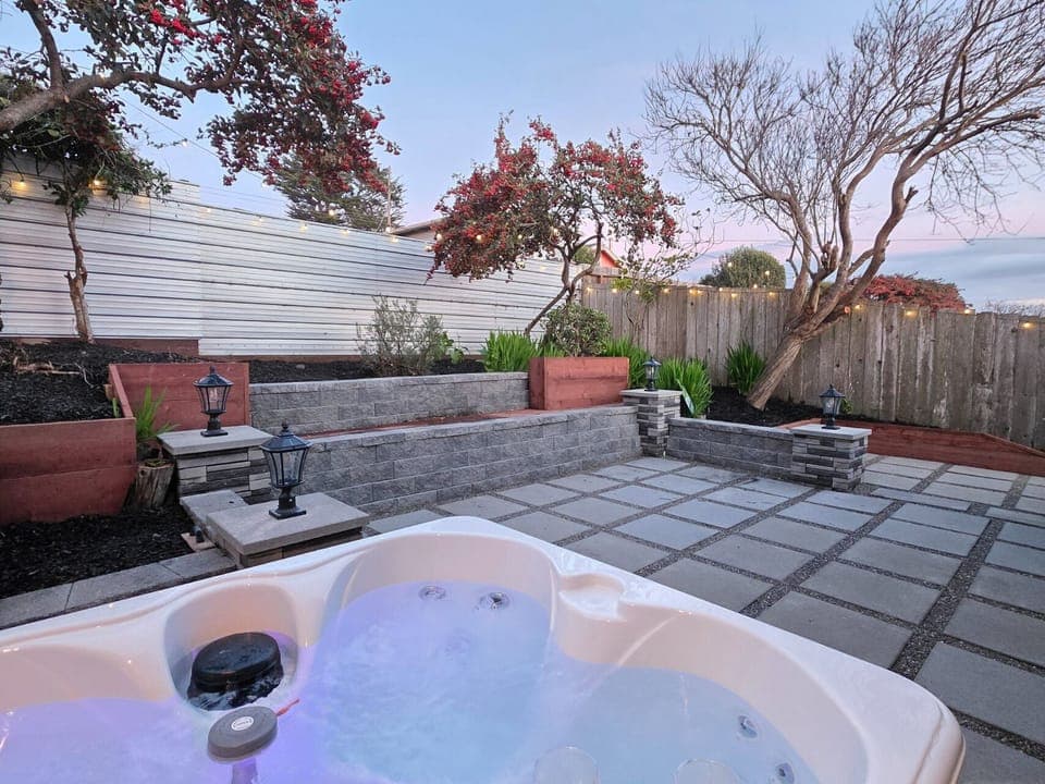 Relax and unwind with a glass of wine in the new hot tub.