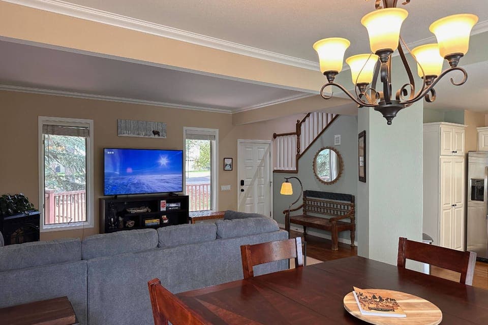Streaming is a breeze w/ Starlink internet! Make yourself at home on this large sectional sleeper sofa and open concept living and dining room.