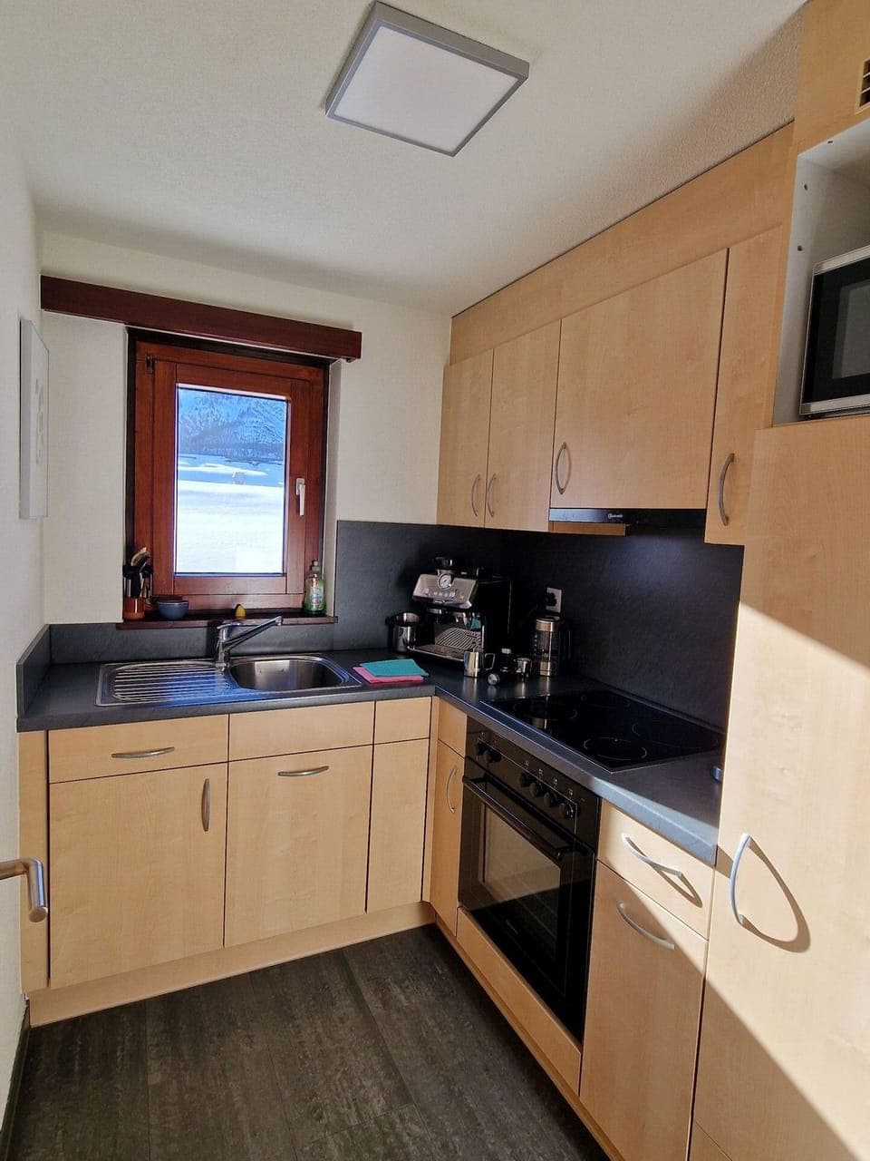 Flooring, Wood, Kitchen, Kitchen Appliance, Interior Design, Cabinetry, Countertop, Floor, Furniture, Major Appliance