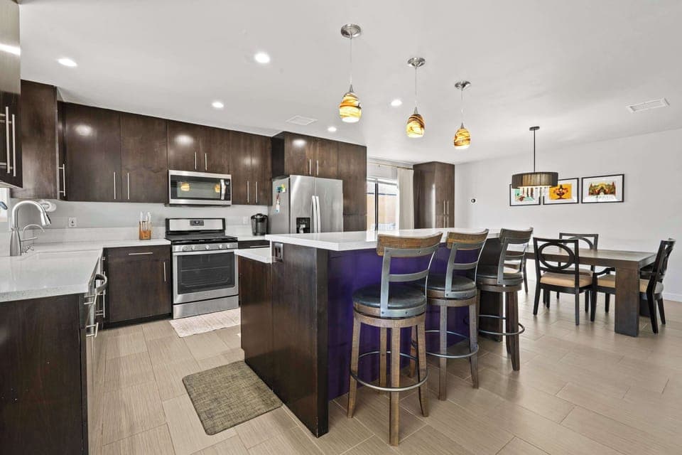 Elegant coastal kitchen with ample space and amenities galore