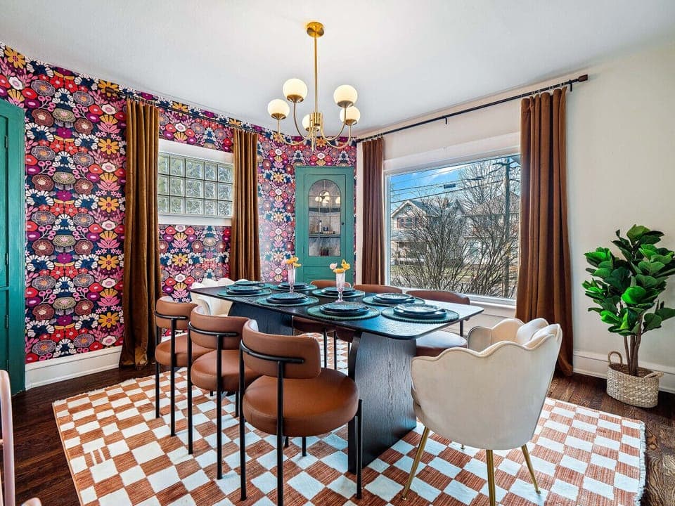 Floral feast for the eyes!  This dining room is a vibrant explosion of color and pattern.  🌸 #HomeDecorGoals