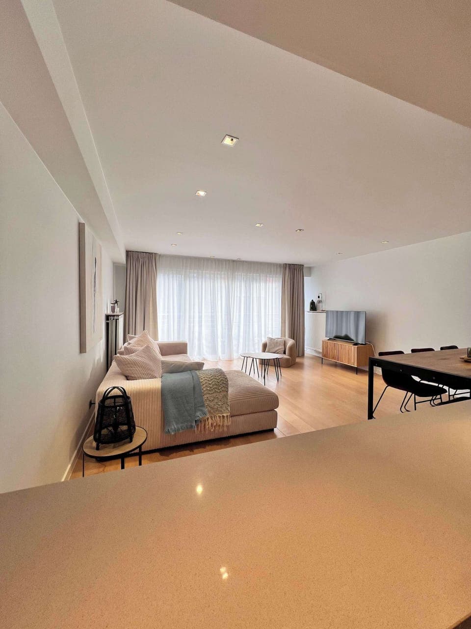 Spacious open living area with cozy seating and modern touches
