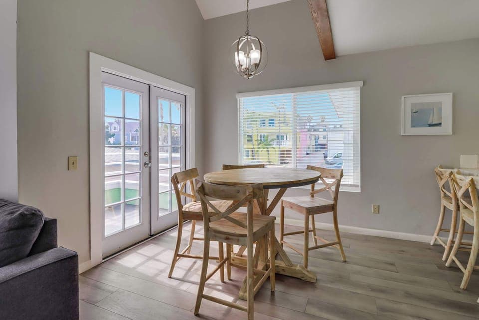 Dining table with kitchen bar and balcony patio