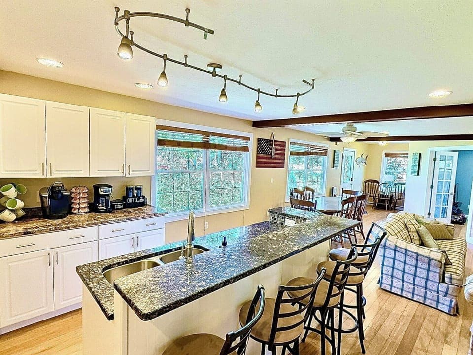 Gather for dinners or game nights in the roomy dining area, with comfy seating nearby for movie marathons or casual conversations.

