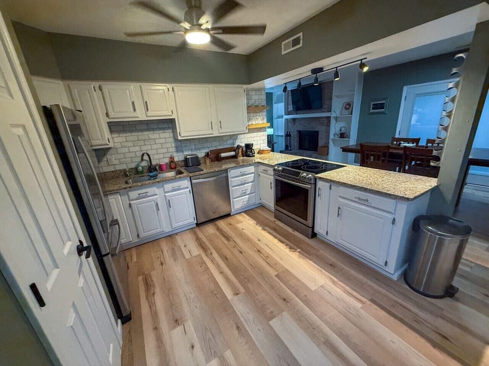 Kitchen with stove, fridge and dishwasher