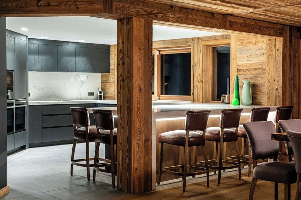 Kitchen with marble island and 6 leather seats