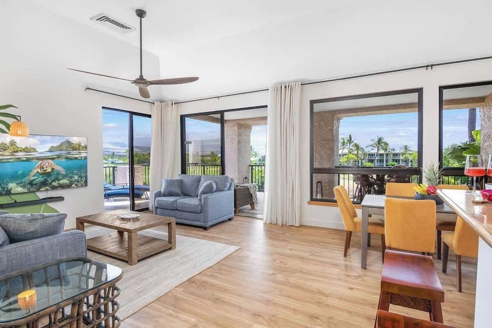 Relax in the cozy living room with a large-screen TV, perfect for movie nights or downtime after a day of exploring.