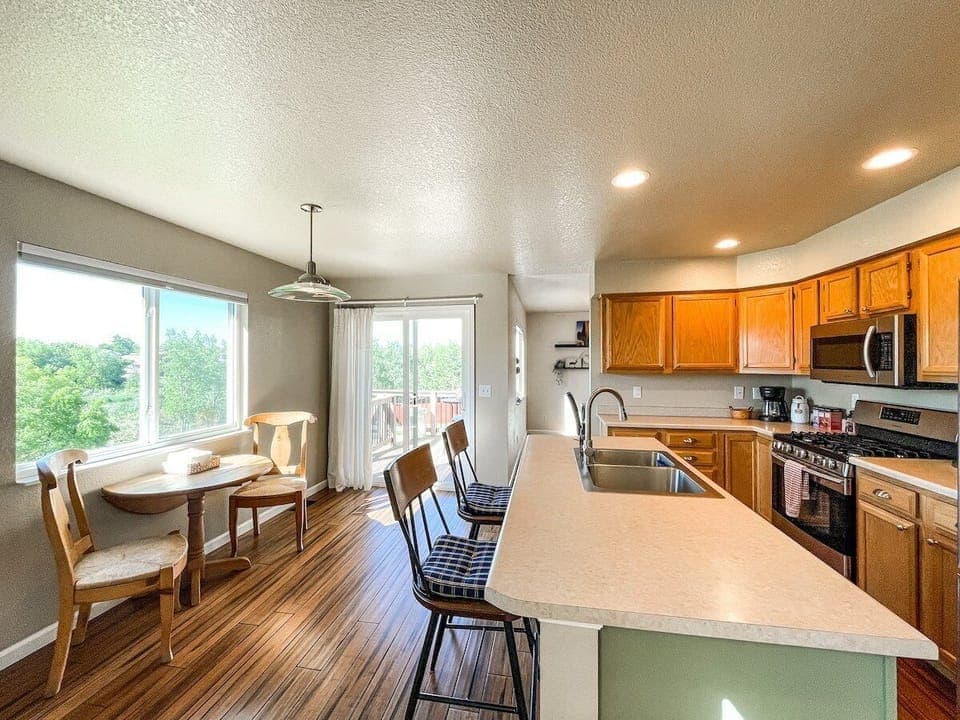 Whip up your favorite meal in our fully stocked kitchen! More seating in the dining room!