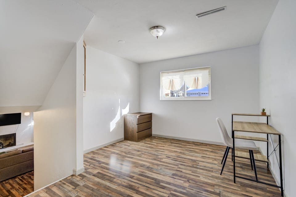 Downstairs, a dedicated workspace offers a quiet area to catch up on some work (note: this area is open, not a closed bedroom and it does not have a door).