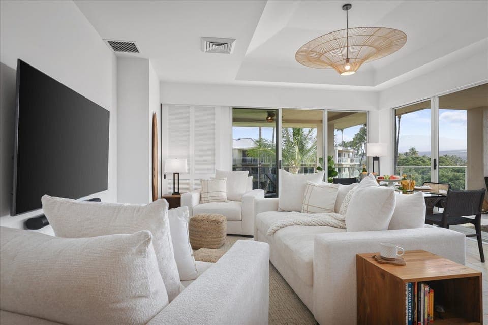 Living room with comfortable seating, cozy lighting, panoramic views.