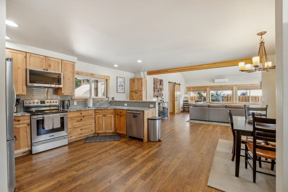 Well-stocked kitchen with views to the living room