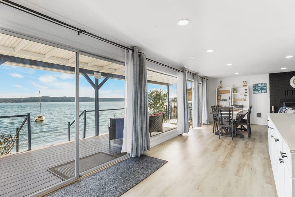 Your views from inside will not disappoint. 3 huge sliders lead out to the deck.