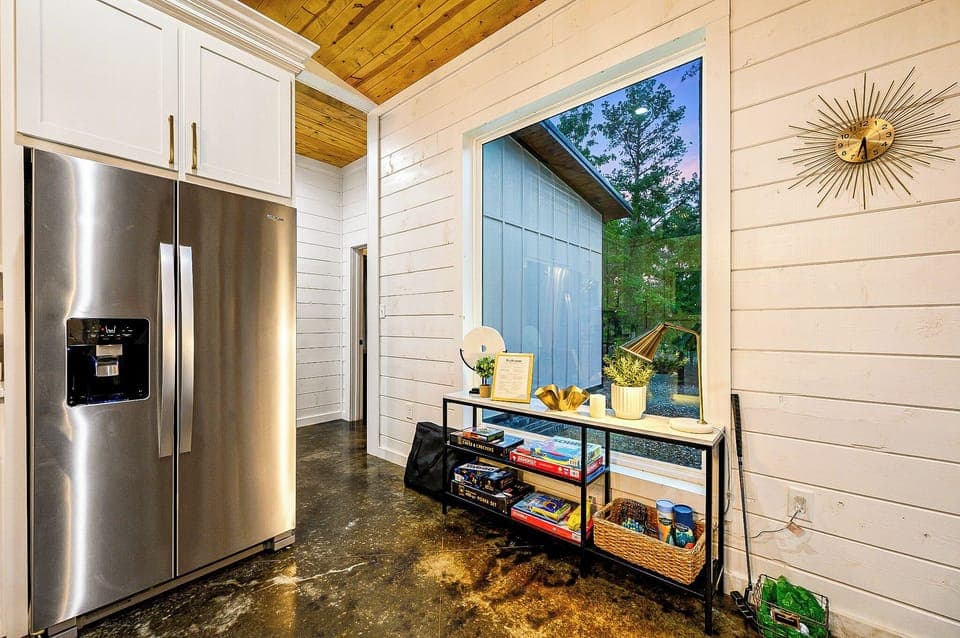 Kitchen: Sleek stainless steel meets nature, perfect for culinary adventures and scenic views!