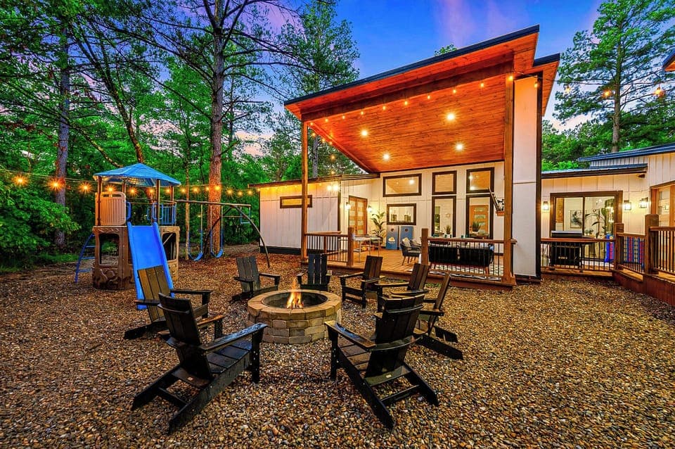 Amazing outdoor space with a playset, firepit area and hot tub
