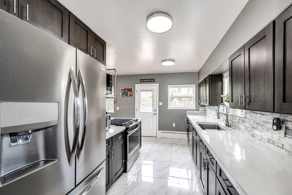 The kitchen is spacious and well-lit. You will enjoy cooking here!