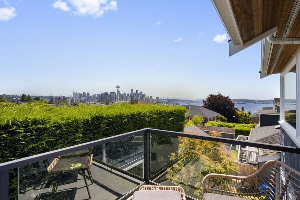 The stunning view of Seattle, featuring the iconic Space Needle, the city skyline, and the waterfront in the background
