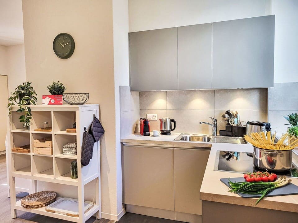 Furniture, Kitchen, Kitchen Appliance, Interior Design, Flooring, Major Appliance, Countertop, Wood, Cabinetry, Floor