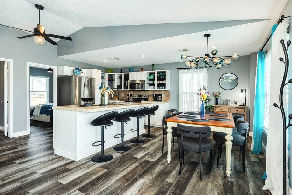The living area opens to the nearby dining room and kitchen