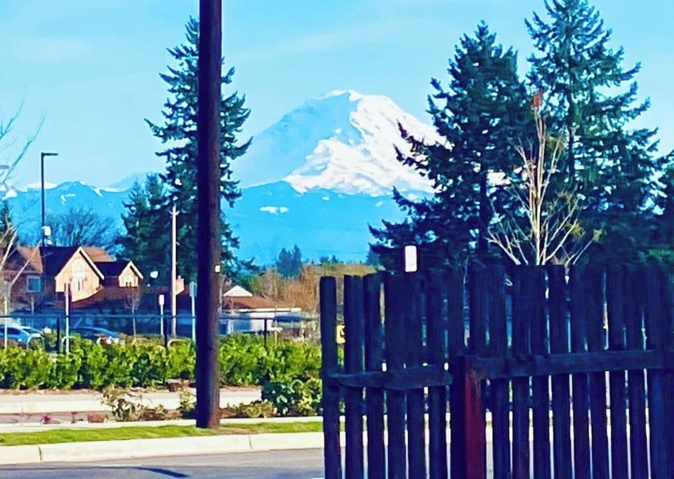 Mount Rainier view from our Backyard and 2 bedrooms when the sky is clear.