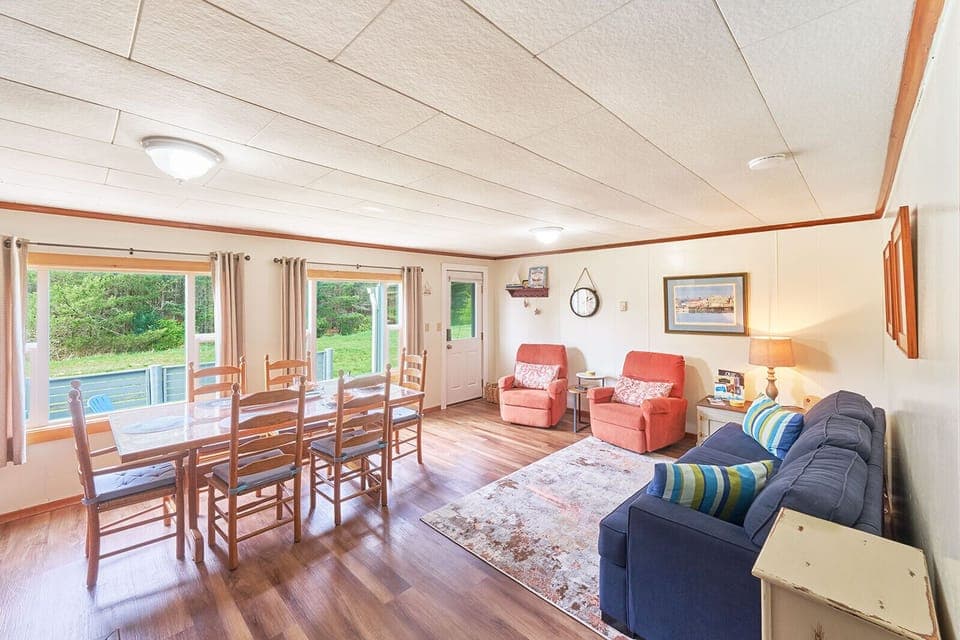 Cozy living area with a comfy queen futon — perfect for lounging or extra sleep space. 🛋️🌟