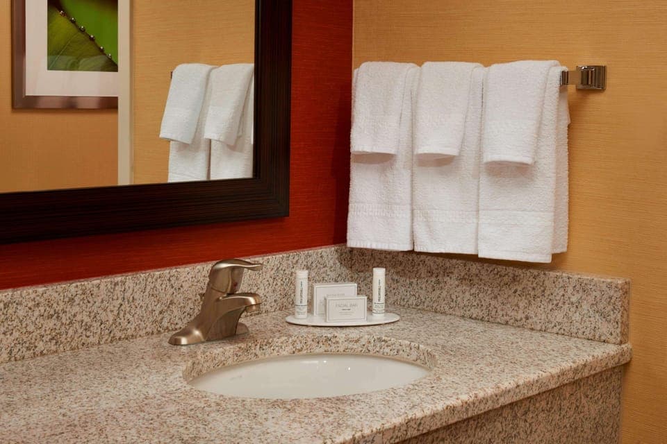 Refresh easily with a clean vanity and plush towels.