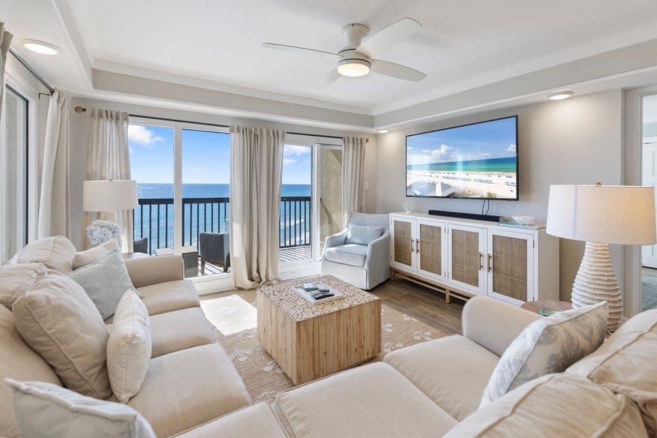 Relax in this bright living space where stunning ocean views and plush seating create your perfect seaside retreat.