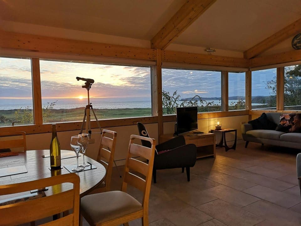 Dining table and chairs, telescope to look at the view