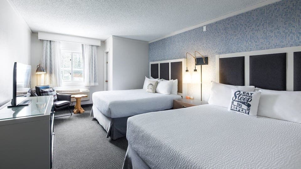 Recharge in a spacious room with comfortable seating and TV.