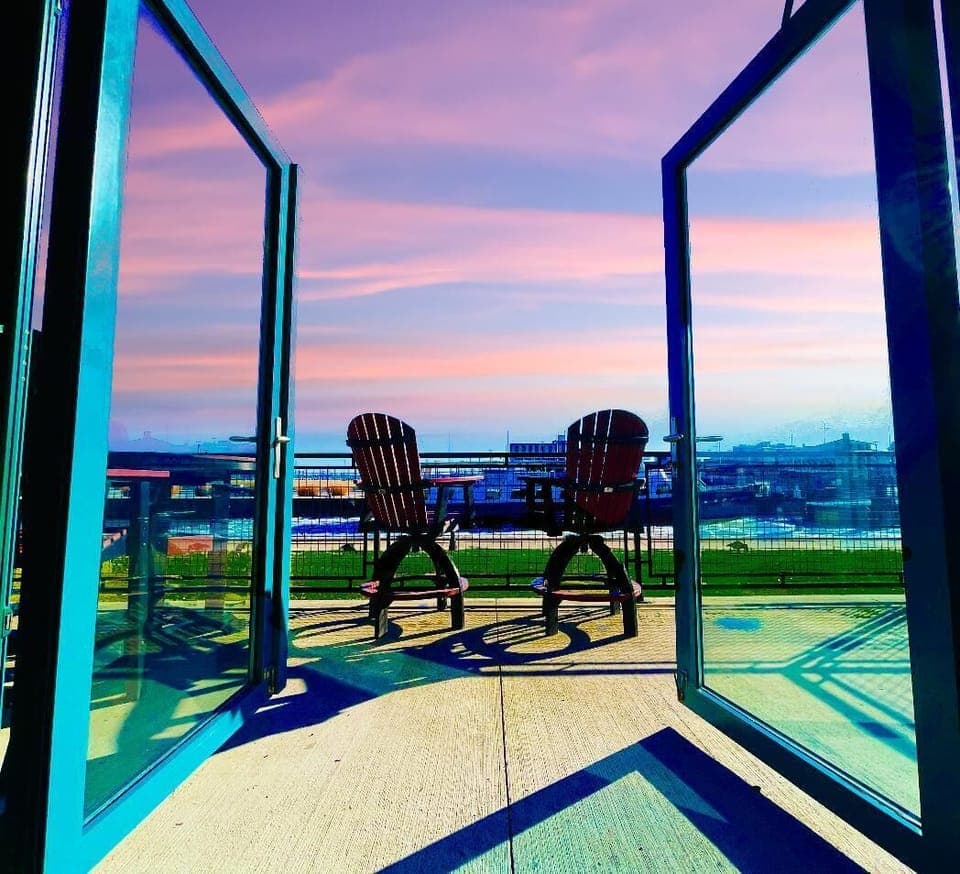 Open the double glass doors and let the fresh lake air fill the space. Whether you're enjoying a cozy night in or stepping outside for a waterfront view, this seamless blend of indoor comfort and outdoor relaxation is pure perfection.