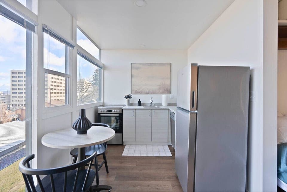 Enjoy cooking in this sleek, modern kitchen with all essentials provided.