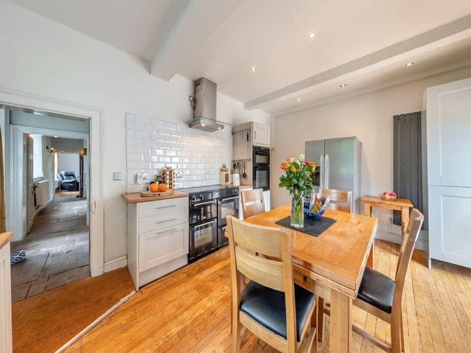 odern kitchen with stainless steel appliances and wood finish