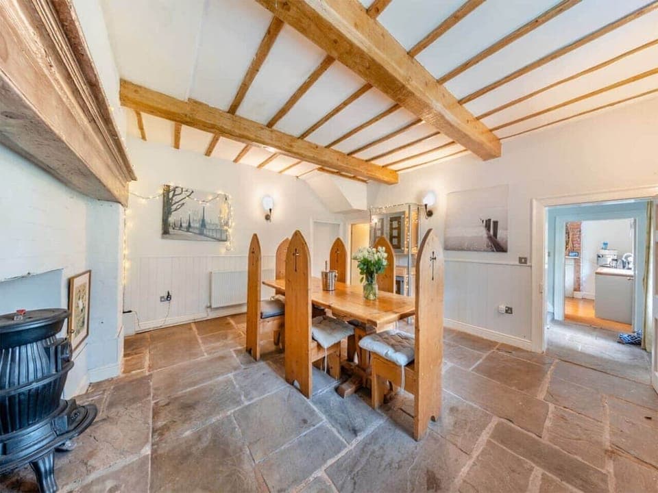Rustic dining room with beamed ceiling and a warm atmosphere
