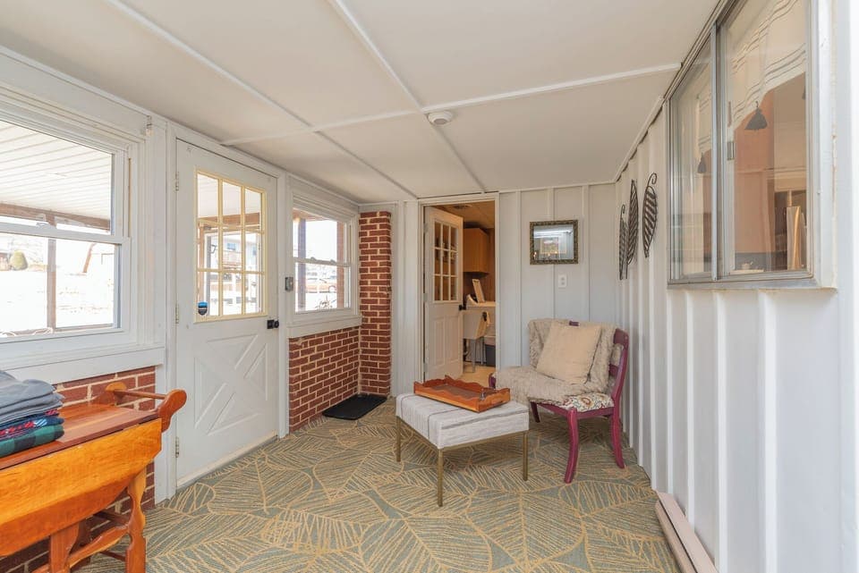 Enclose summer porch lead to the laundry room and screened patio