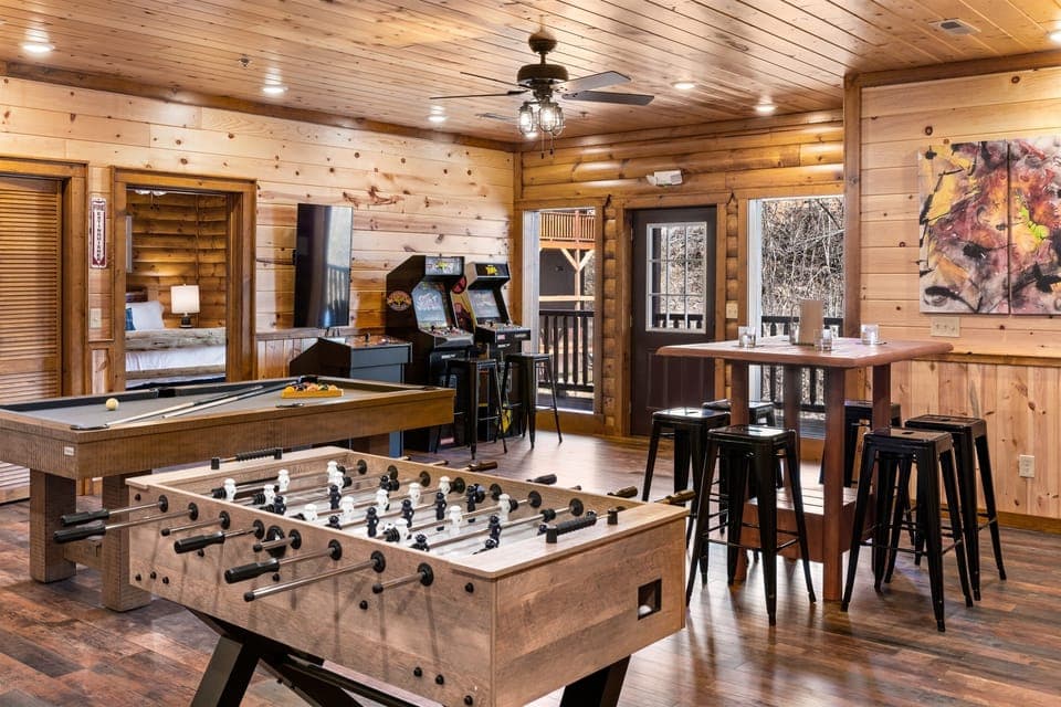 Fun-filled game room with arcades, pool table, and foosball!