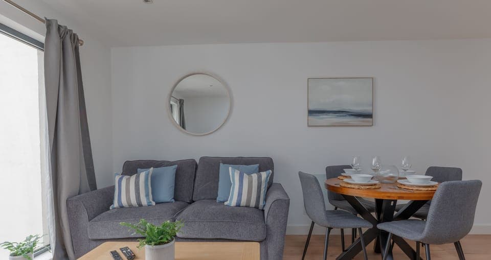 The well equipped living room has a modern and comfortable style