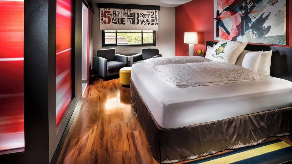 Sink into plush bedding in a bold, modern retreat.