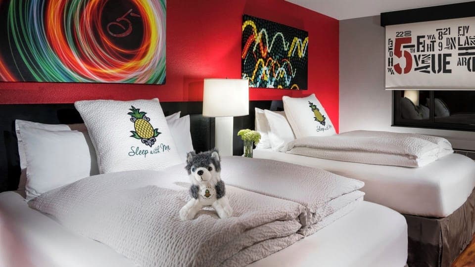 Stretch out on crisp linens beneath bold, playful art