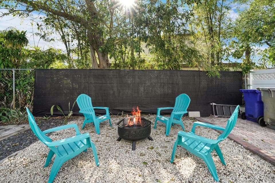 Enjoy the warmth and ambiance of the outdoor patio, complete with a cozy fire pit.